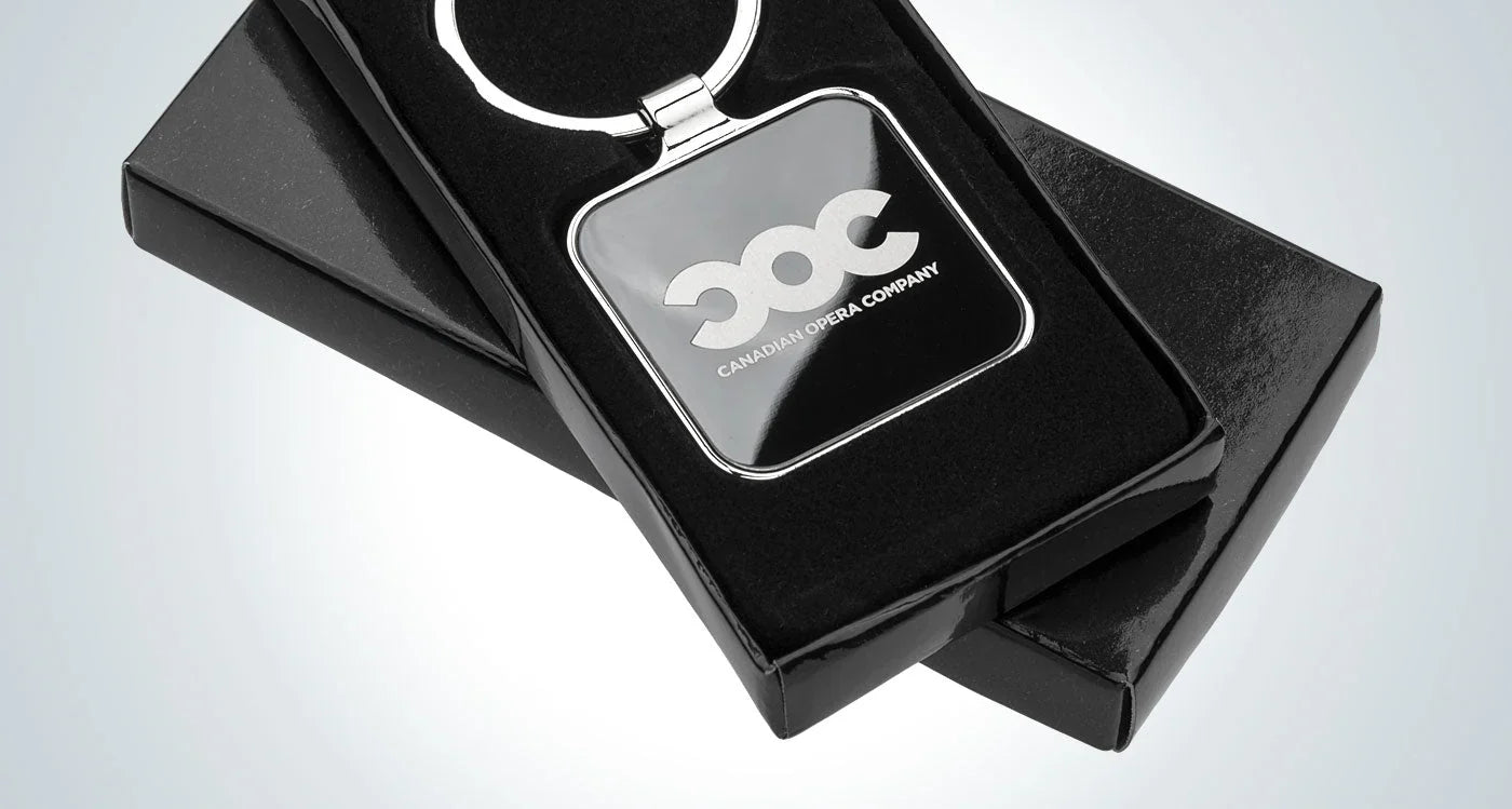 Custom engraved metal keychains in various shapes and platings.
