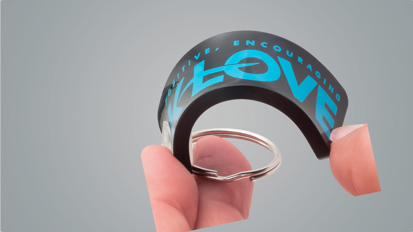 Soft Vinyl Keychain Bending in a Hand